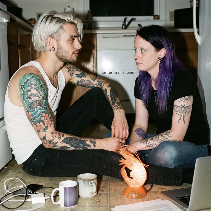 just us in this room cover: two people on a kitchen floor, a shrimp lamp, two mugs.